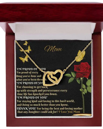 gold interlocking hearts necklace in mahogany box up close