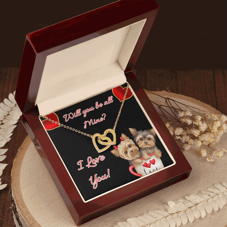 gold interlocking hearts necklace in a mahogany box