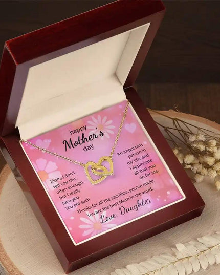  yellow gold Interlocking Hearts Necklace on a stump