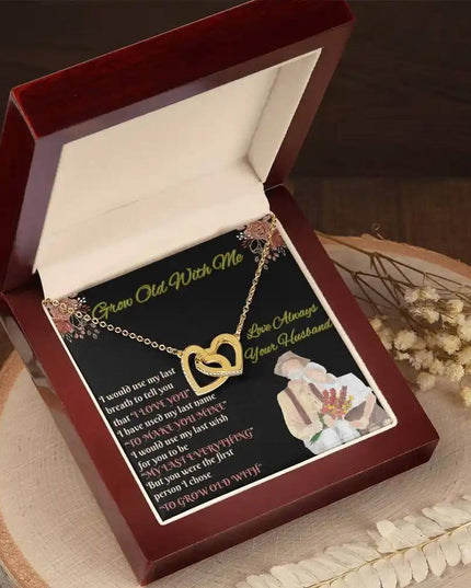 yellow gold interlocking hearts necklace in mahogany box angled left