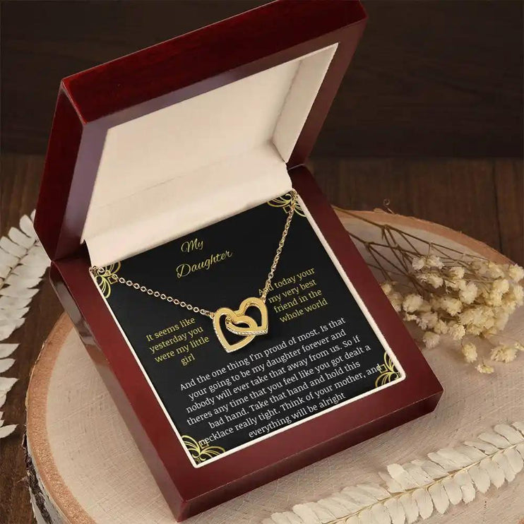 Interlocking Hearts NecInterlocking Hearts Necklace with a gold charm in a mahogany box angle 2klace with a gold charm in a two-tone box angle 1