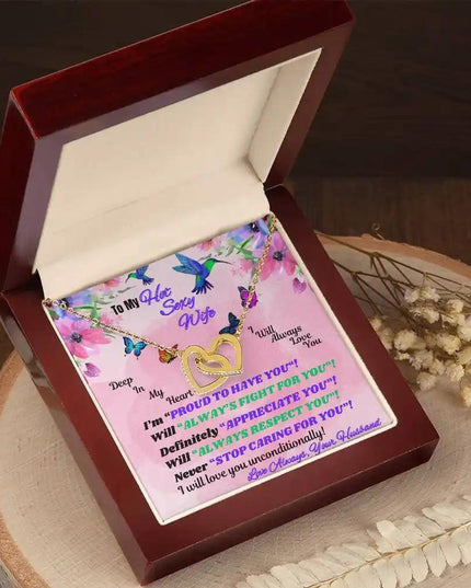 yellow gold interlocking hearts necklace in mahogany box angled left