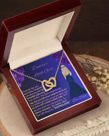 gold interlocking hearts necklace in mahogany box angled left
