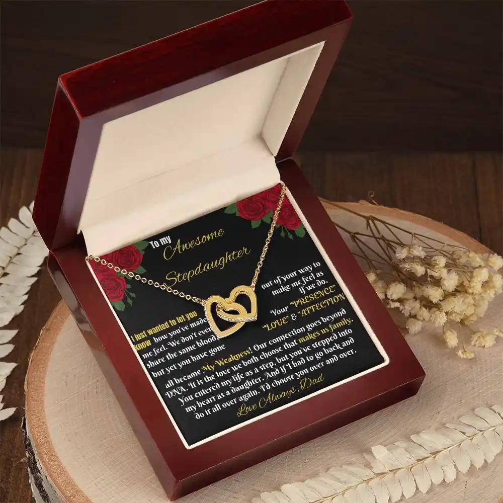 gold interlocking hearts necklace in mahogany box angled left