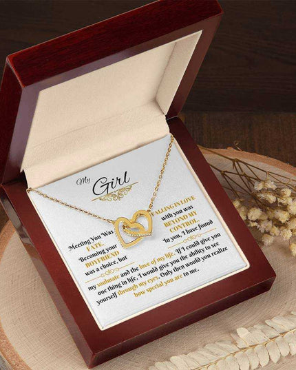 gold interlocking hearts necklace in luxury box angled left