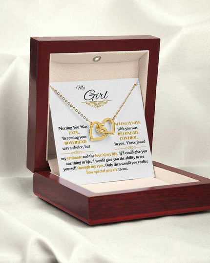gold interlocking hearts necklace in luxury box angled left