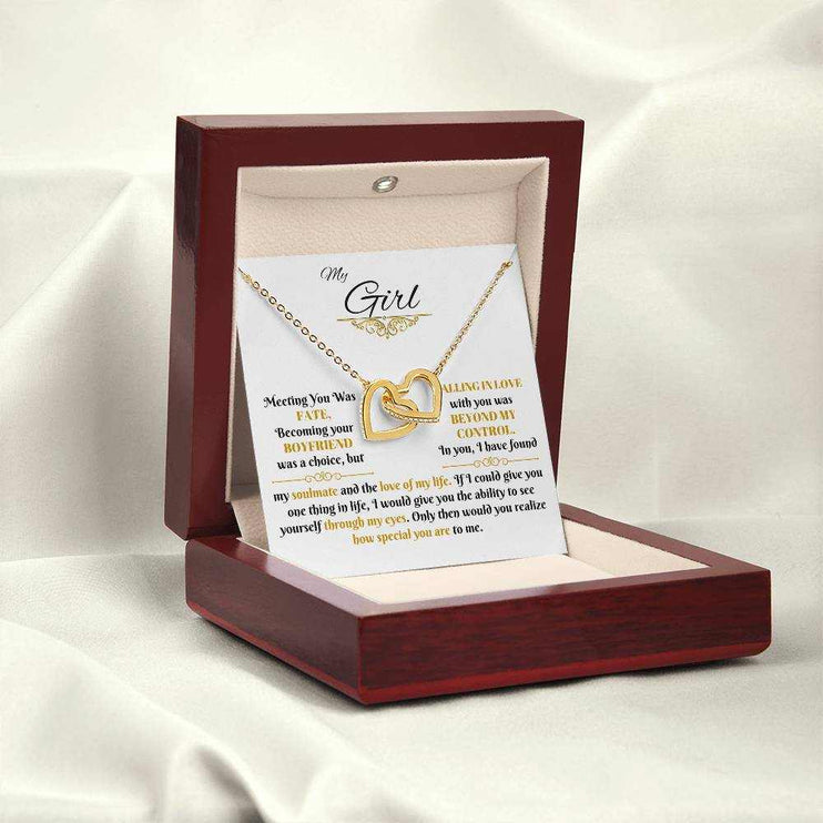 gold interlocking hearts necklace in luxury box angled left