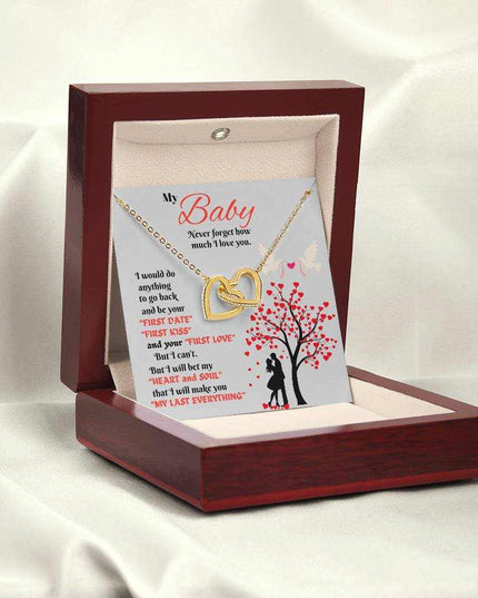 gold interlocking hearts necklace in luxury box angled left