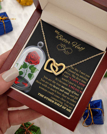 18k interlocking hearts necklace in a luxury box in model's hand