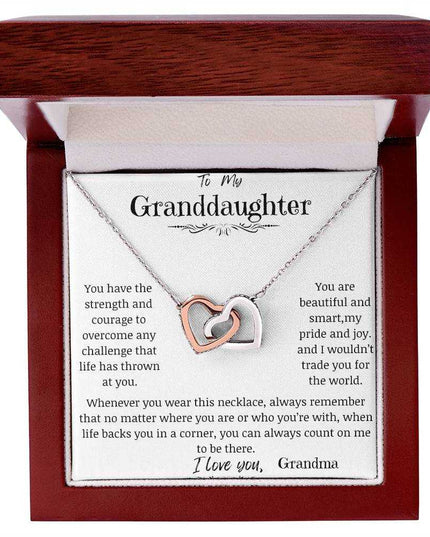 a rose gold interlocking hearts necklace in a mahogany box