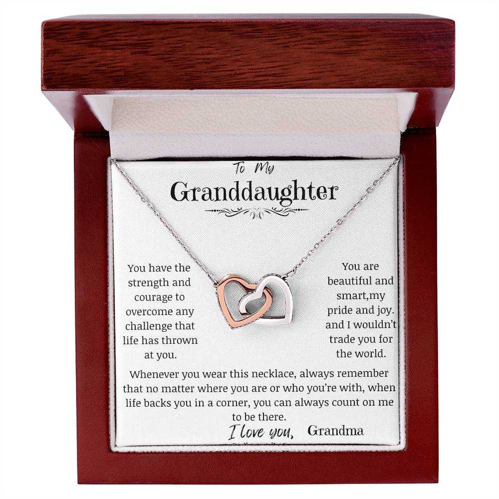 a rose gold interlocking hearts necklace in a mahogany box