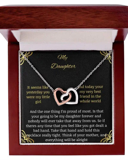 Interlocking Hearts Necklace with a rose gold charm in a mahogany box angle 1