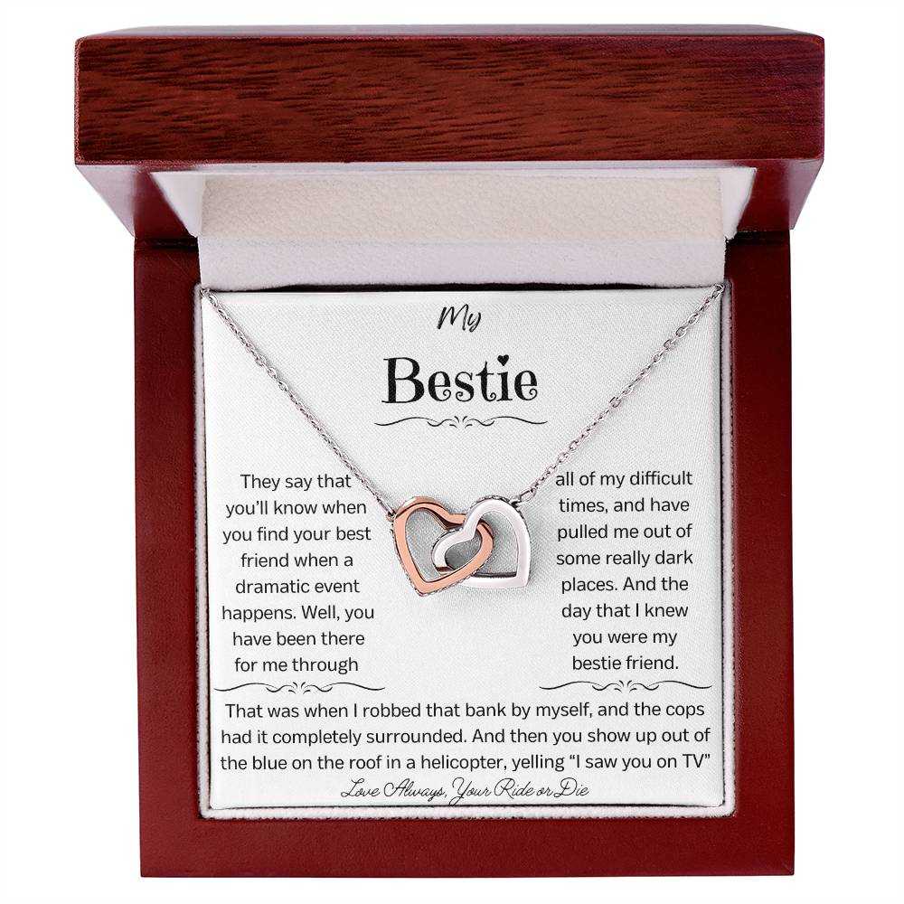 a rose gold interlocking hearts necklace in a mahogany box