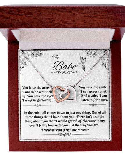 rose gold interlocking hearts necklace in a luxury box up close