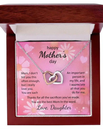  rose gold Interlocking Hearts Necklace up close in mahogany box