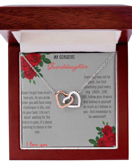 Interlocking Hearts Necklace with rose gold charm in a mahogany box