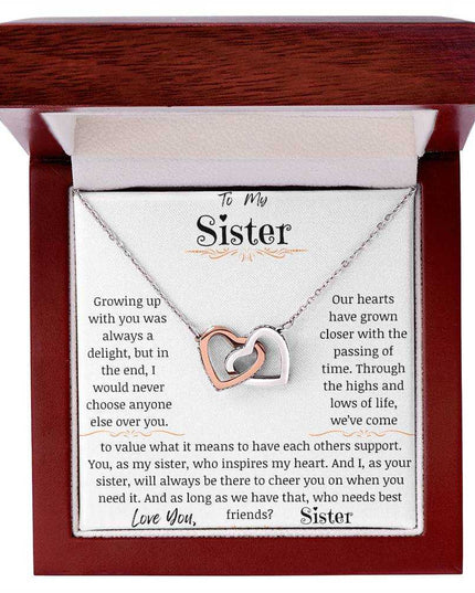 a rose gold interlocking hearts necklace in a mahogany box
