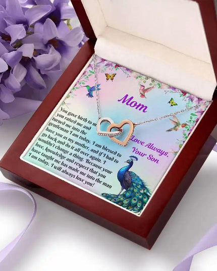 rose gold interlocking hearts necklace in mahogany box angled right 