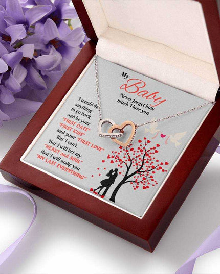 rose gold interlocking hearts necklace in luxury box angled right