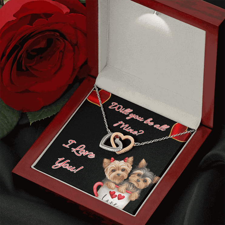 rose gold interlocking hearts necklace in a mahogany box with a red rose