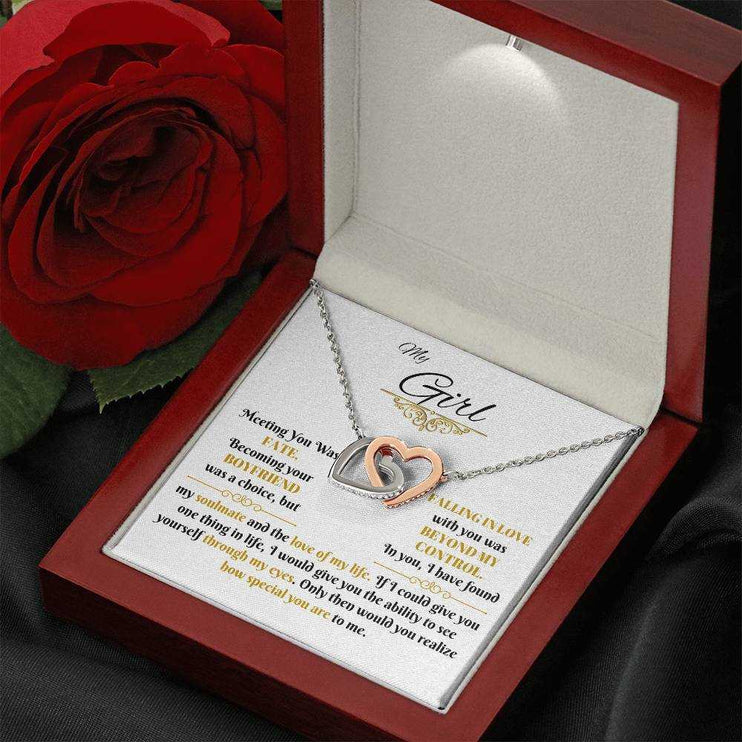 rose gold interlocking hearts necklace in luxury box angled right