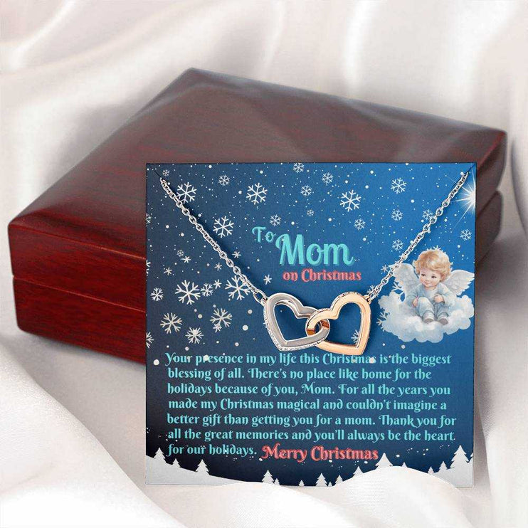 rose gold interlocking hearts necklace outside of closed luxury box