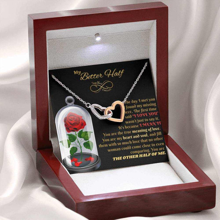 rose gold interlocking hearts necklace in luxury box angled left