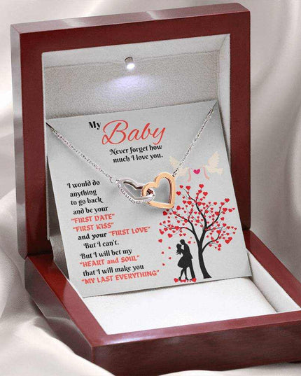 rose gold interlocking hearts necklace in luxury box angled left