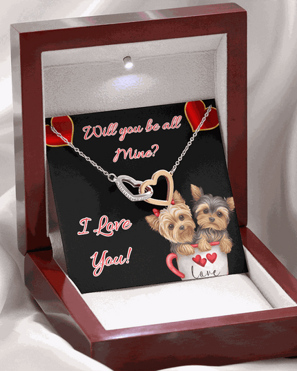 rose gold interlocking hearts necklace in a mahogany box with led light on