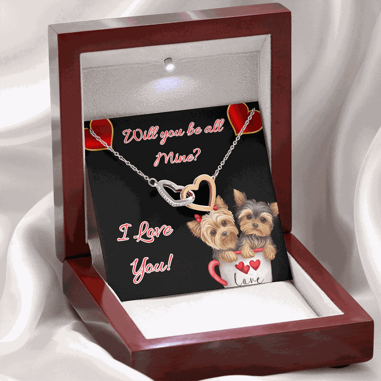 rose gold interlocking hearts necklace in a mahogany box with led light on