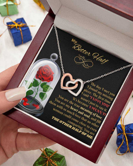 rose gold interlocking hearts necklace in luxury box in model's hand
