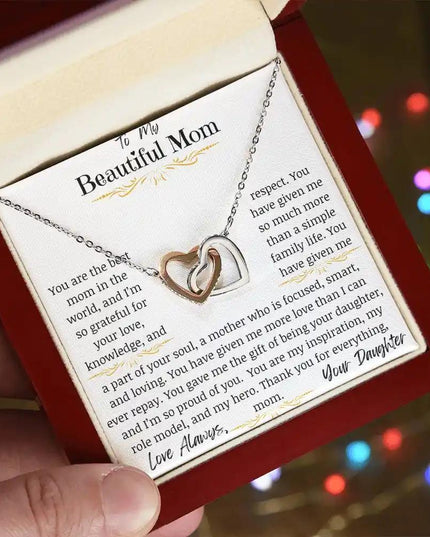 a rose gold interlocking hearts necklace angled left