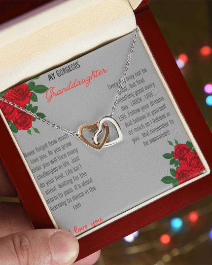 Interlocking Hearts Necklace with rose gold charm in a mahogany box angle 2