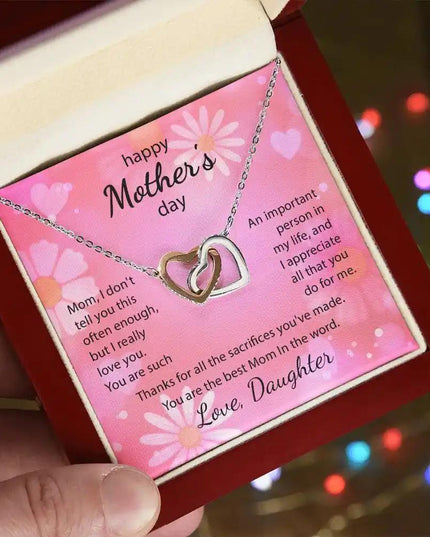  rose gold Interlocking Hearts Necklace in mahogany box angled left