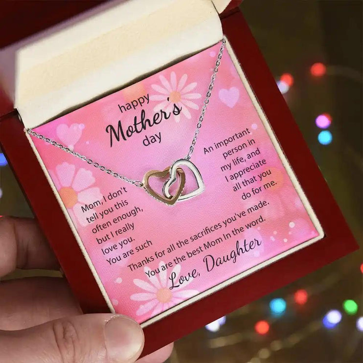  rose gold Interlocking Hearts Necklace in mahogany box angled left