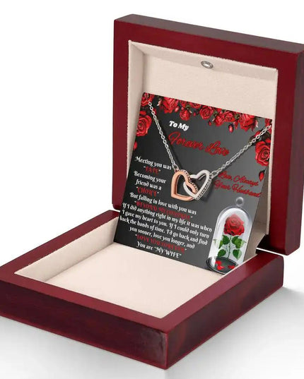 rose gold interlocking hearts necklace in mahogany box angled right