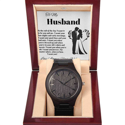 wooden watch in a mahogany box with greeting card inside up close