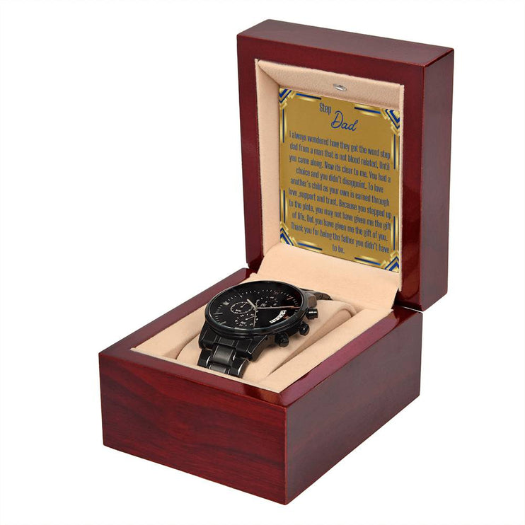 a men's chronograph watch in a mahogany box angled right