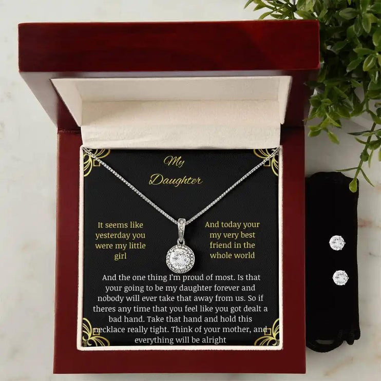 A eternal hope necklace earring set in a mahogany box up close