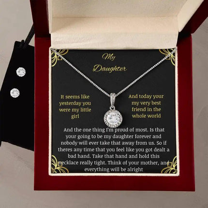 A eternal hope necklace earring set in a mahogany box on a table