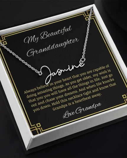 Signature Name Necklace with a polished stainless-steel finish on a to granddaughter from grandpa greeting card in a two-tone box