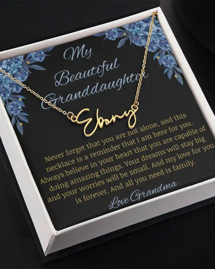 Signature Name Necklace with a yellow gold finish on a to my beautiful granddaughter from grandma greeting card in a two-tone box