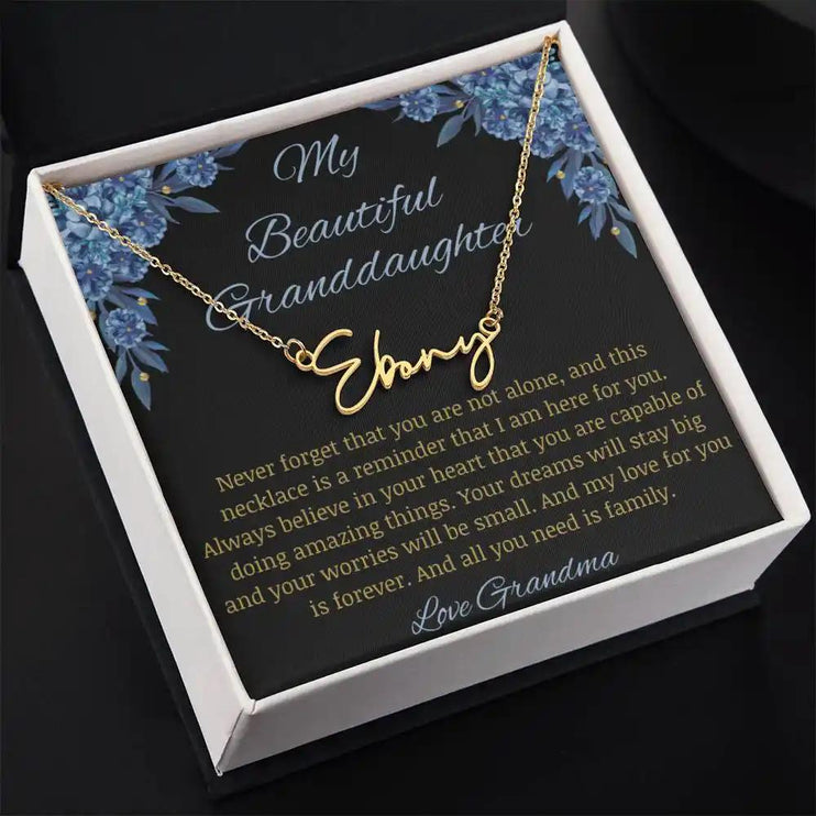 Signature Name Necklace with a yellow gold finish on a to my beautiful granddaughter from grandma greeting card in a two-tone box