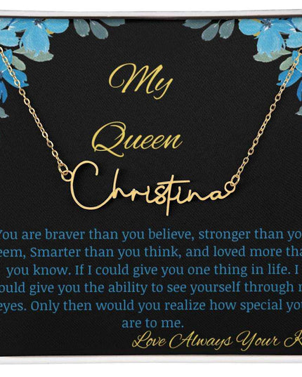 A yellow gold signature name necklace in a two-tone box with a to my queen greeting card.