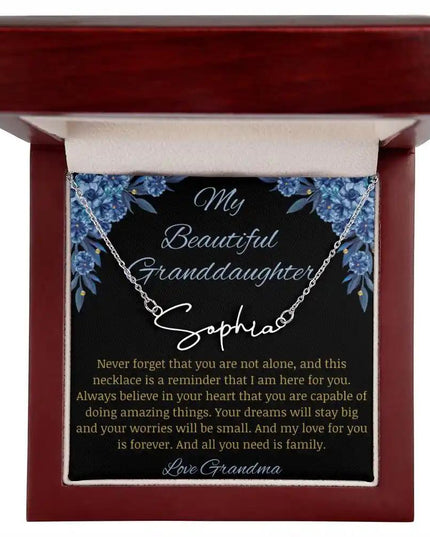 Signature Name Necklace with a polished stainless-steel finish on a to my beautiful granddaughter from grandma greeting card in a mahogany box up close