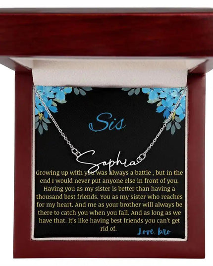 Signature Name Necklace with a polished stainless-steel charm on a to sis from bro greeting card in a mahogany box