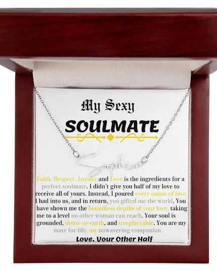 a polished stainless-steel signature name necklace in a mahogany box.