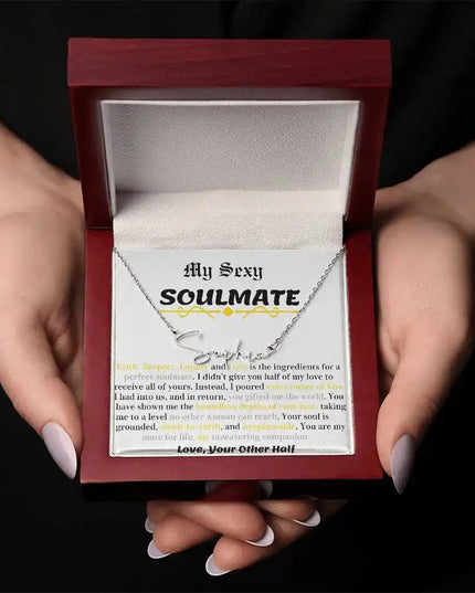 a polished stainless-steel signature name necklace in a two-tone box.