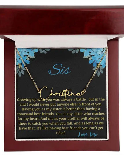 Signature Name Necklace with a yellow gold charm on a to sis from bro greeting card in a mahogany box