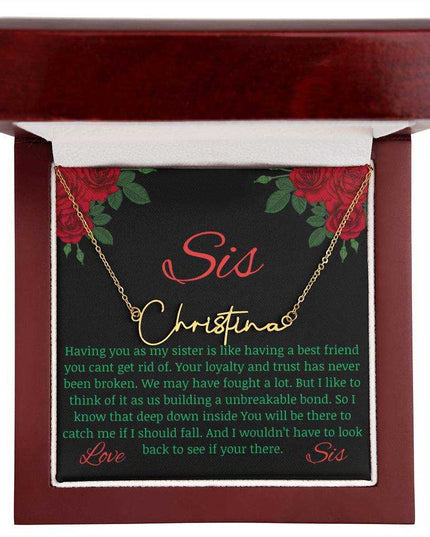Signature Style Name Necklace with a yellow gold finish variant on a To Sis from Sis greeting inside a mahogany box up close.